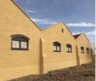 A&A Enterprises Engineering — finished facade with arched windows