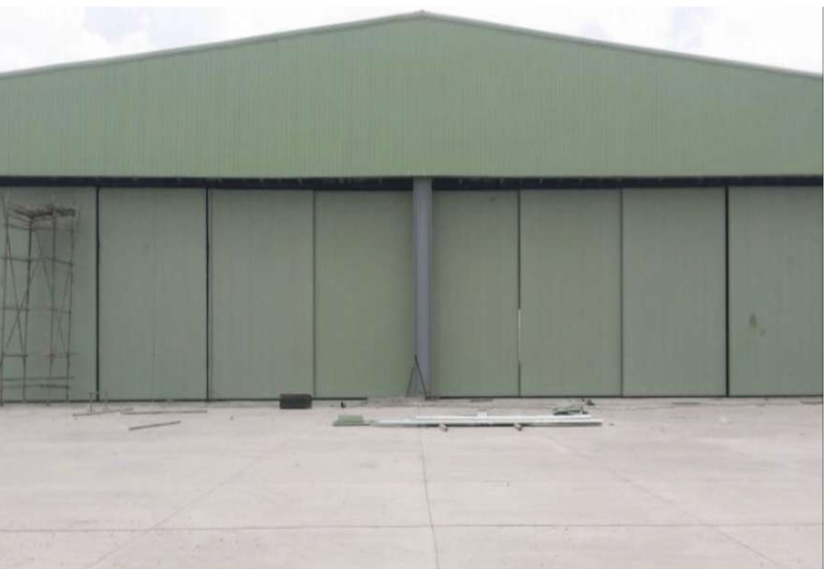 A&A Enterprises Engineering — green hangar with sliding doors